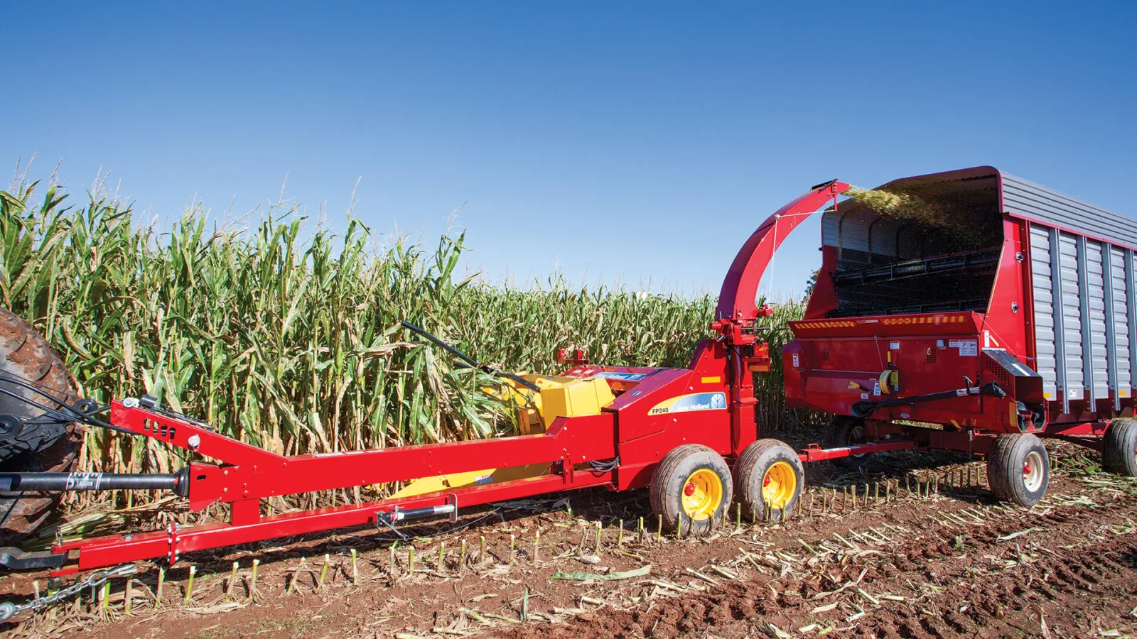 Representative New Holland FP240 pull-type forage harvester chopping corn