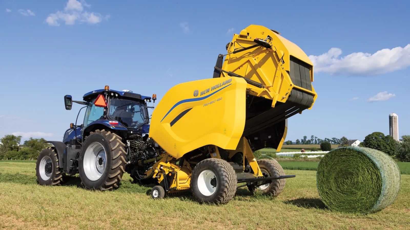 Representative New Holland Pro-Belt round baler forming a hay bale